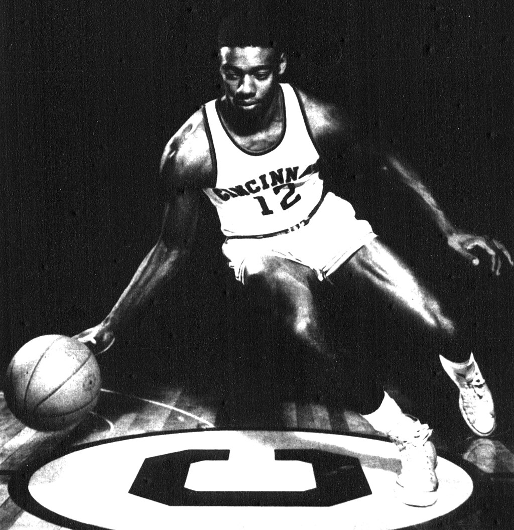 Black and white photograph of Oscar Robertson dribbling a basketball.